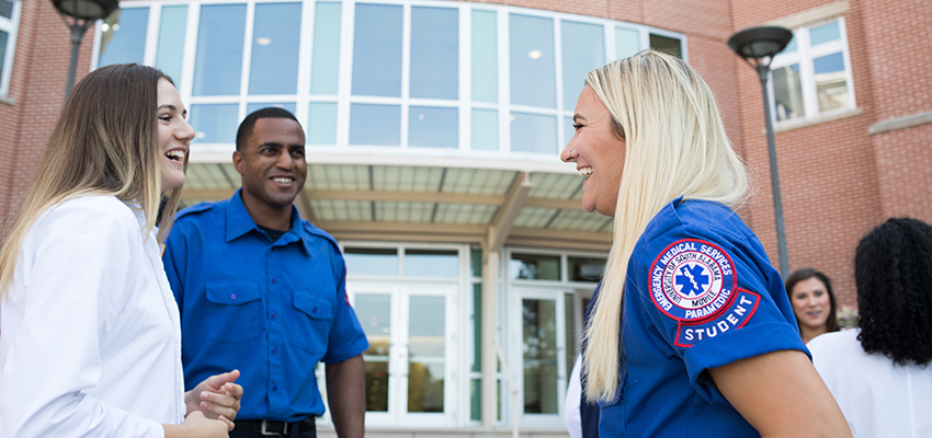 Image of students outside the Health Sciences building.