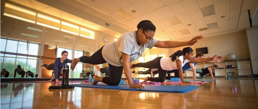 A group of women practicing yoga.