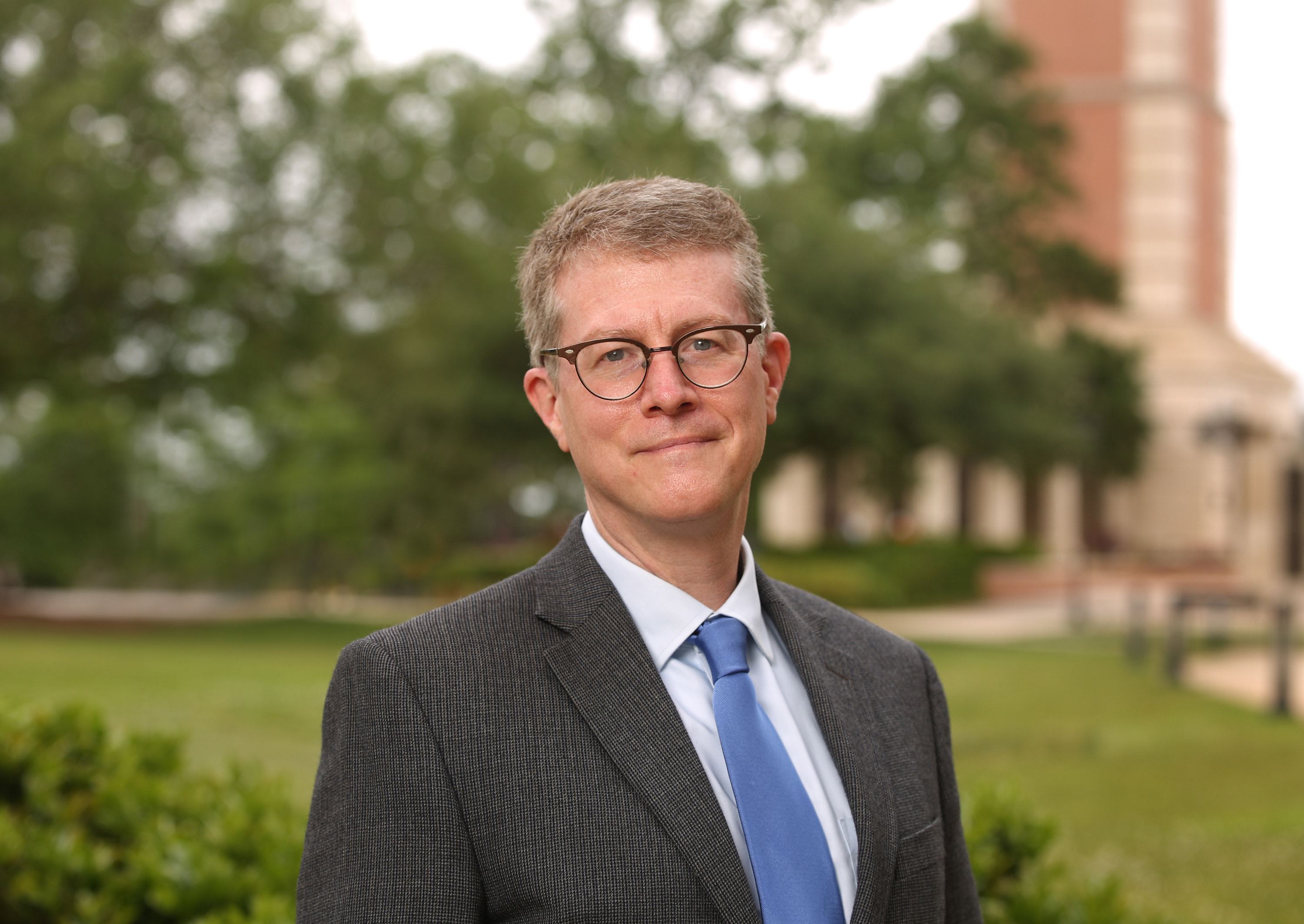 John Halbrooks photo of Dr. John Halbrooks standing in front of the Moulton Tower