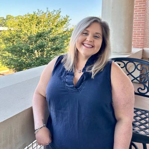 olivia standing on balcony of meisler