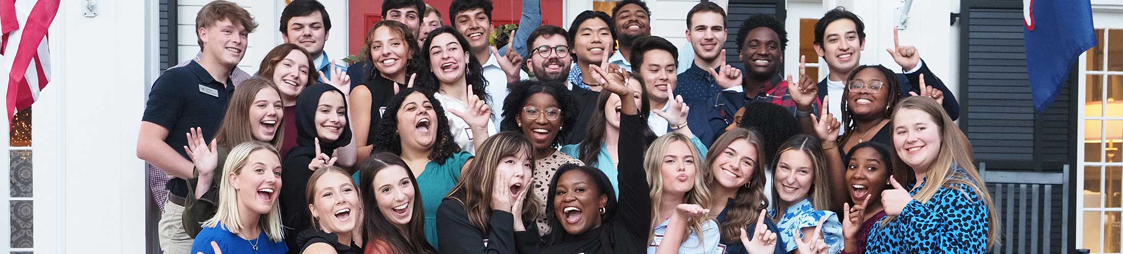 Group of student leaders for student organizations in front of the President's house.